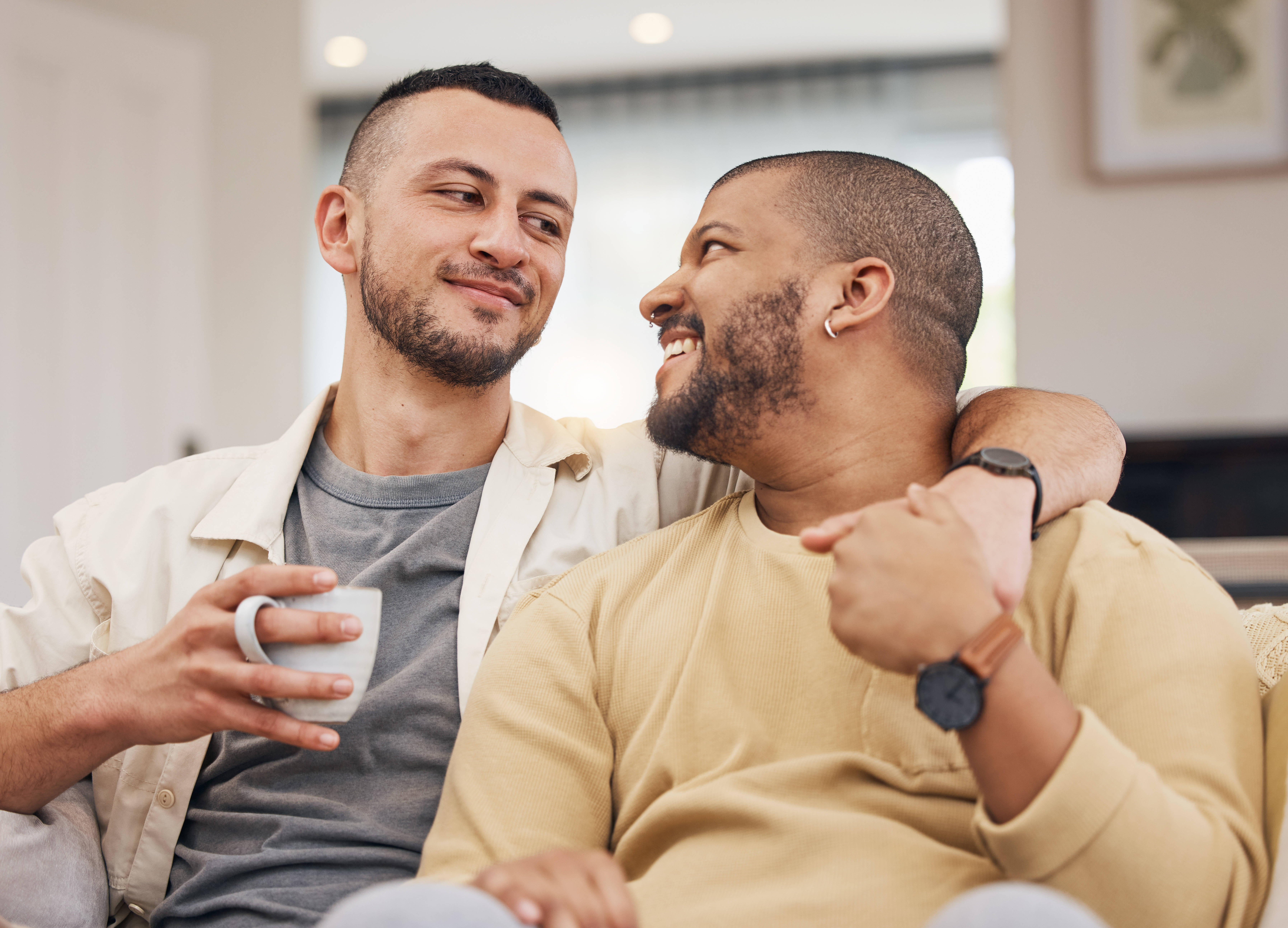 Two men having an intimate conversation over coffee