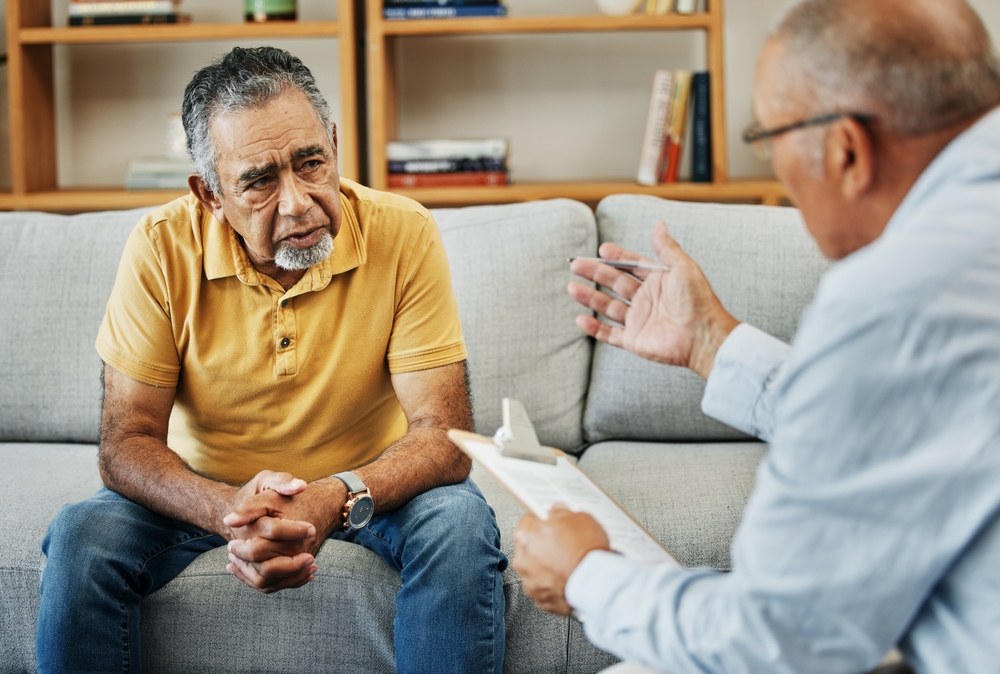 Man talking to therapist