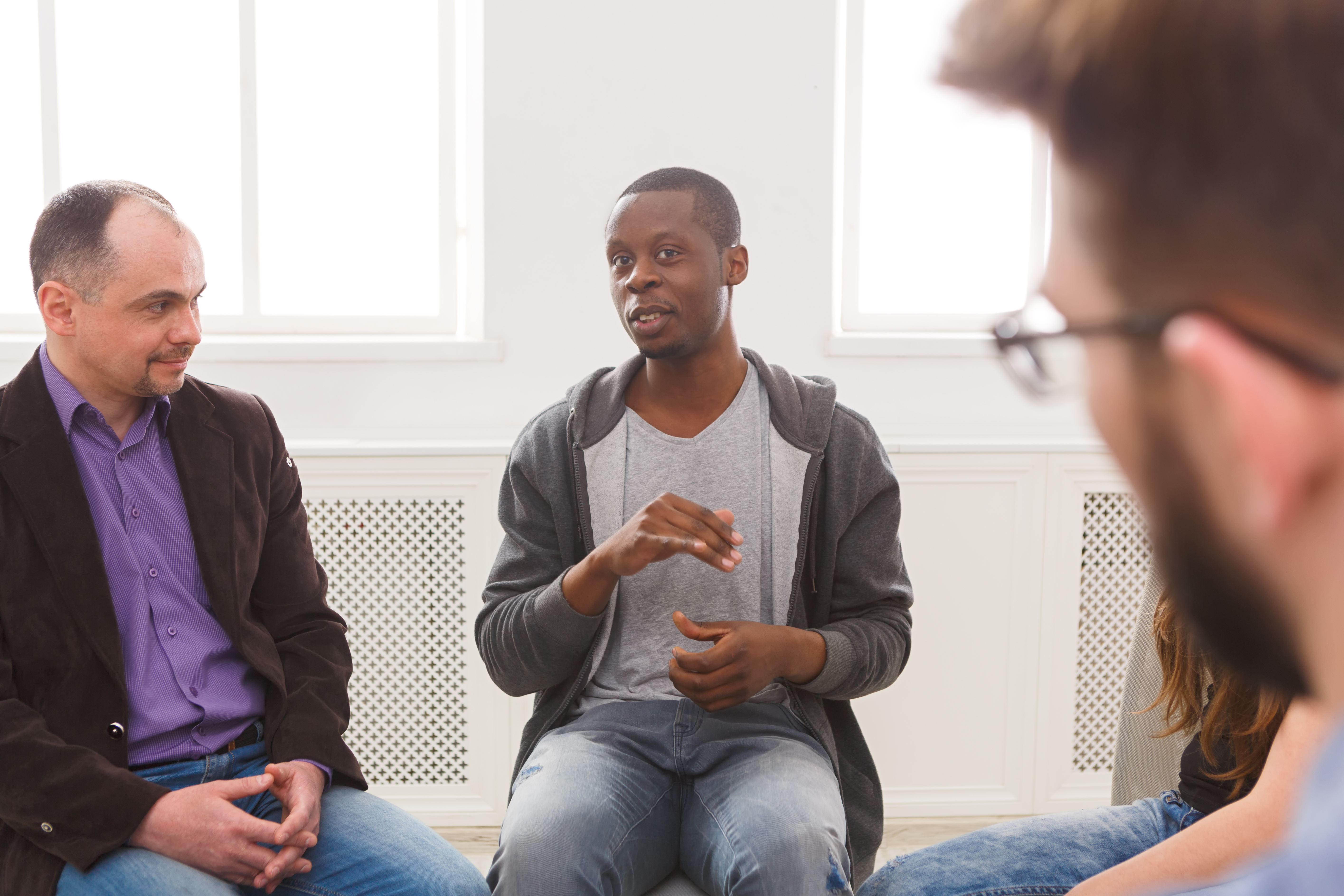 Men sitting in a support group