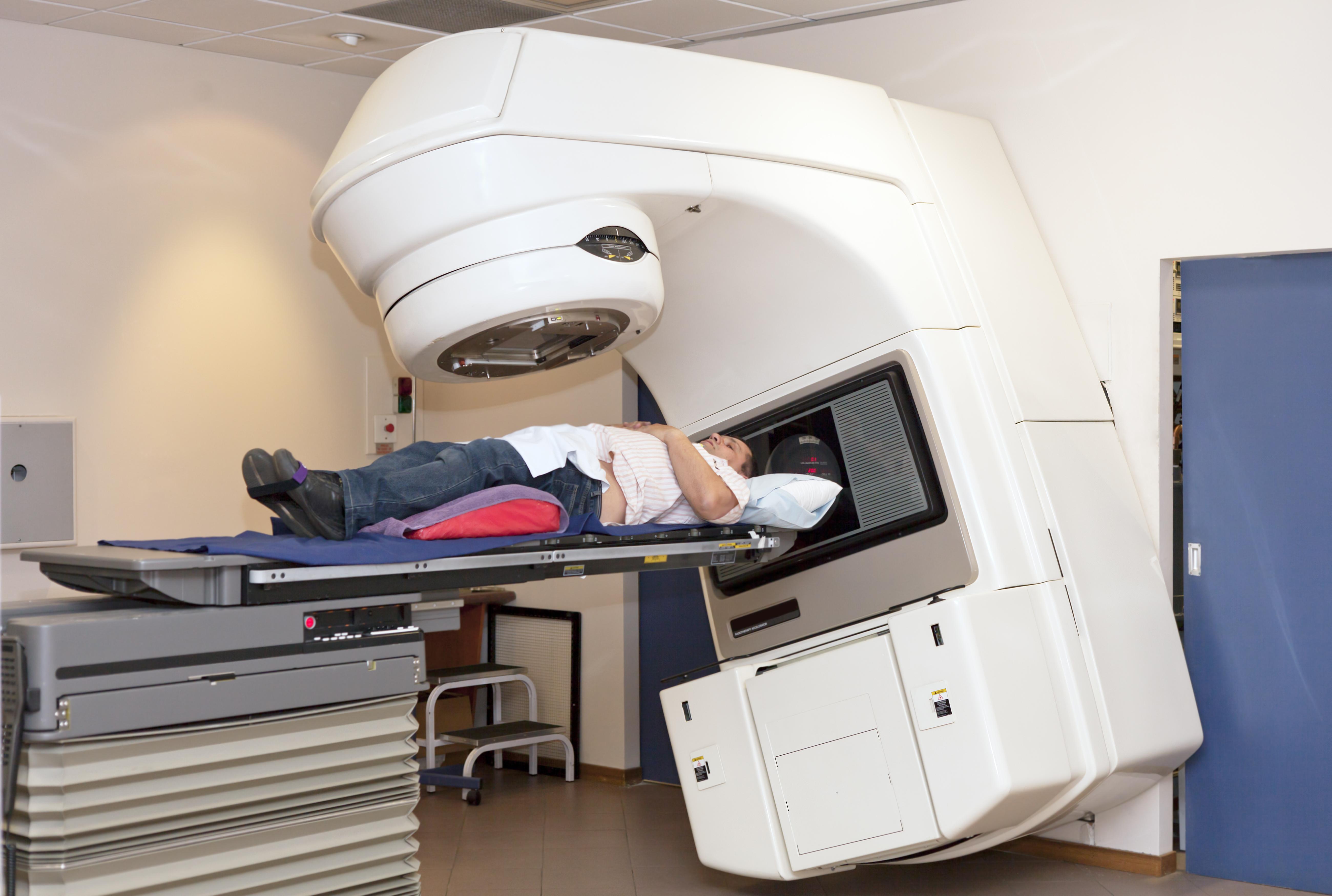 Man lying in radiotherapy machine